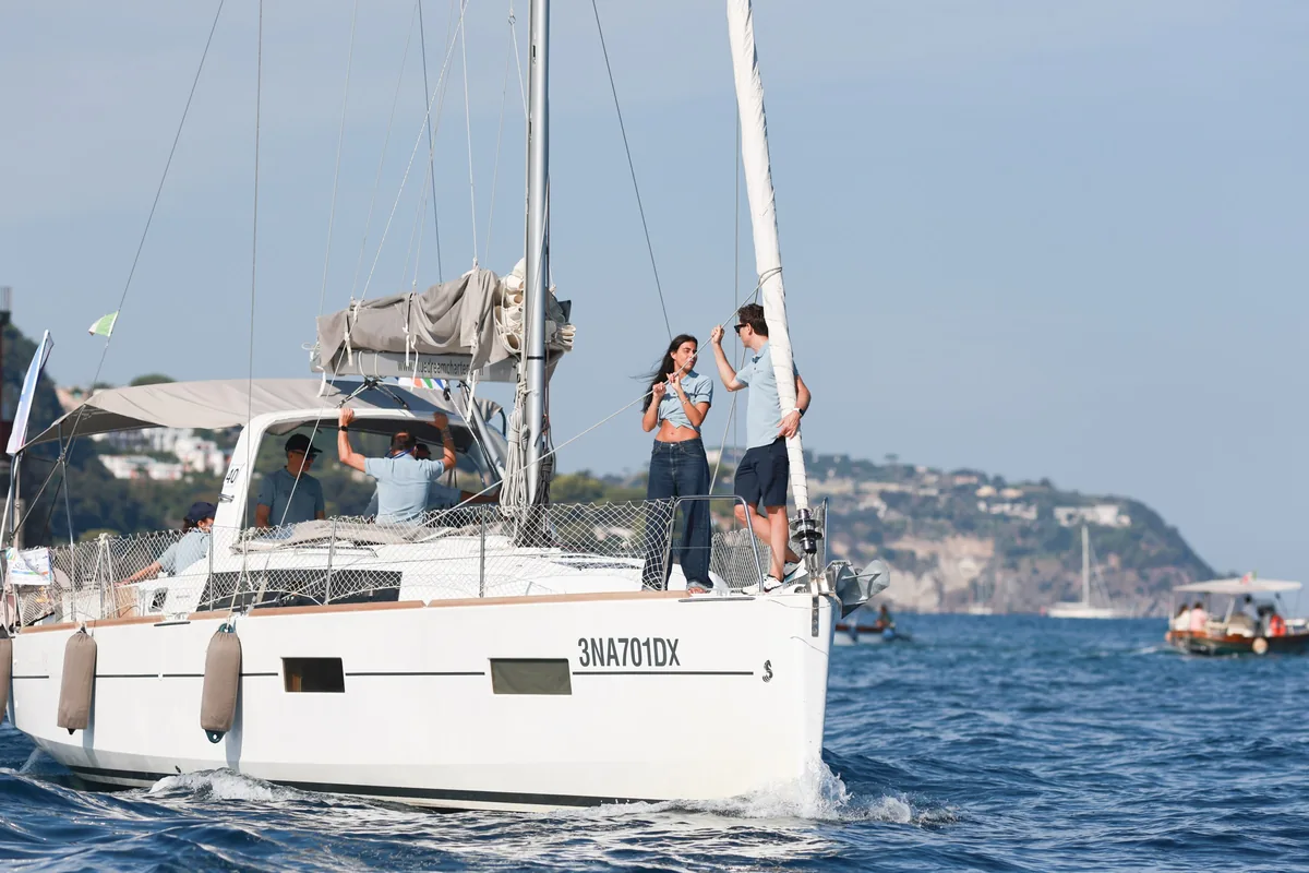 Enrico Ariotti and Mary Manna of nCore HR at the bow of the boat sailing in the Gulf of Naples